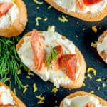 Smoked Salmon Crostini on a black slate board