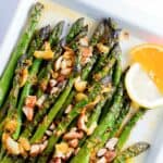 Asparagus spears with citrus sauce and chopped almonds