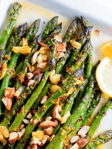 Asparagus spears with citrus sauce and chopped almonds