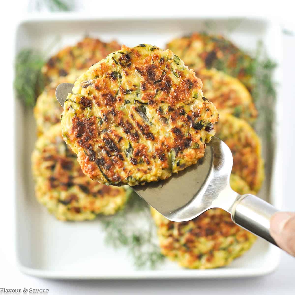 A baked zucchini patties on a lifter