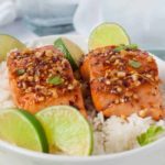 Honey Chili Lime Glazed Salmon served with rice and fresh lime slices