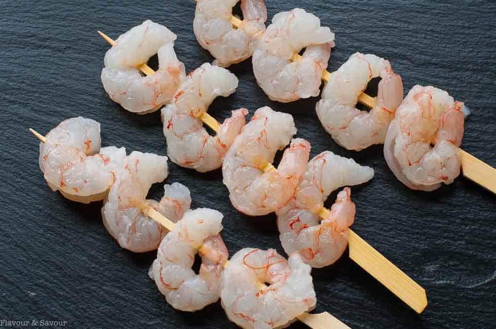 raw shrimp threaded on pre-soaked bamboo skewers