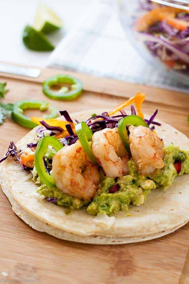 Shrimp Tacos with zesty Tomatillo Guacamole and Cilantro Lime Slaw.