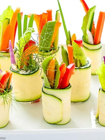 Fresh Veggie Zucchini Roll-ups on a platter.