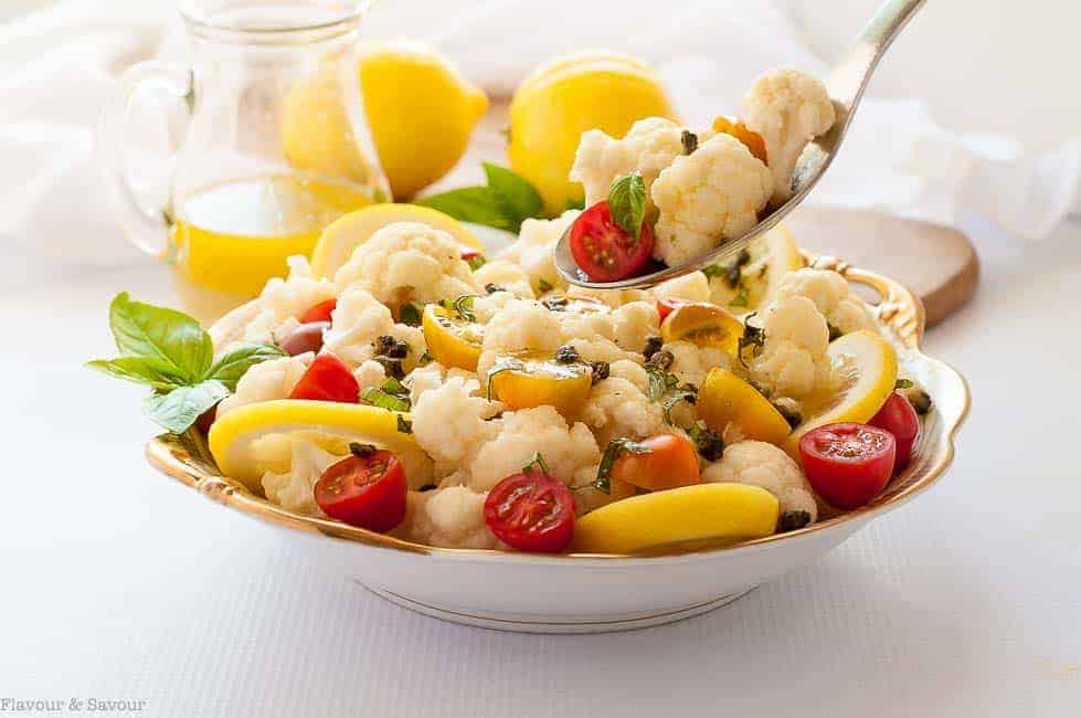 Taking a spoonful of Cauliflower Lemon Basil Salad 