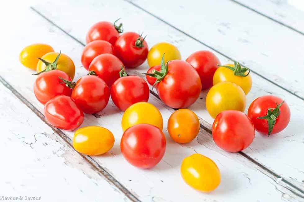 Cherry Tomatoes on a white painted board background
