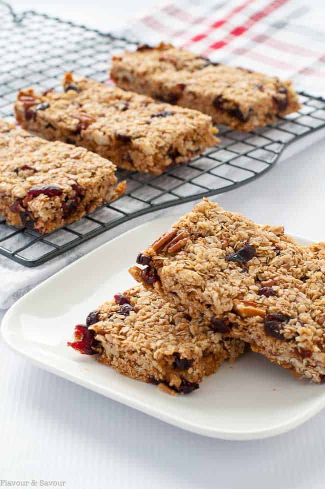 These Chewy Cranberry Pecan Oat Bars are naturally sweetened with honey and coconut palm sugar. They're a perfect make-ahead bar as they freeze well. |www.flavourandsavour.com