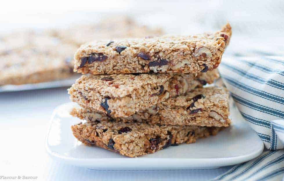 These Chewy Cranberry Pecan Oat Bars are naturally sweetened with honey and coconut palm sugar. They're a perfect make-ahead bar as they freeze well. |www.flavourandsavour.com