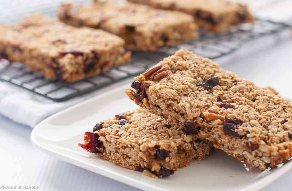 These Chewy Cranberry Pecan Oat Bars are naturally sweetened with honey and coconut palm sugar. They're a perfect make-ahead bar as they freeze well. |www.flavourandsavour.com 
