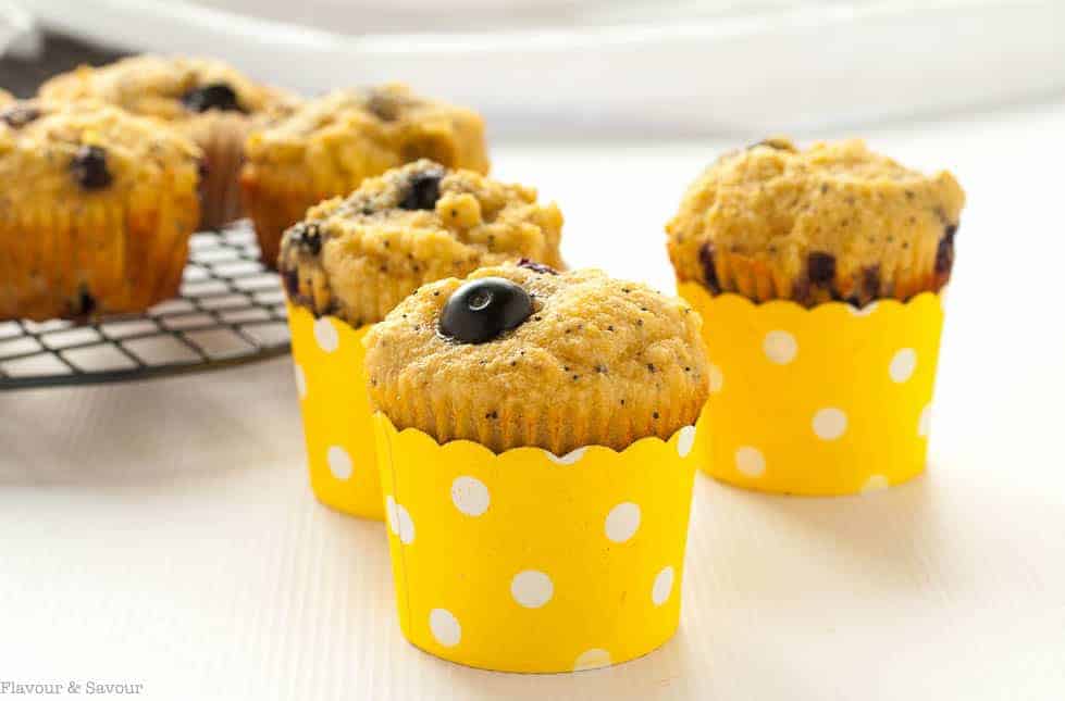 Paleo Blueberry Lemon Poppy Seed Muffins in yellow polka dot cups.