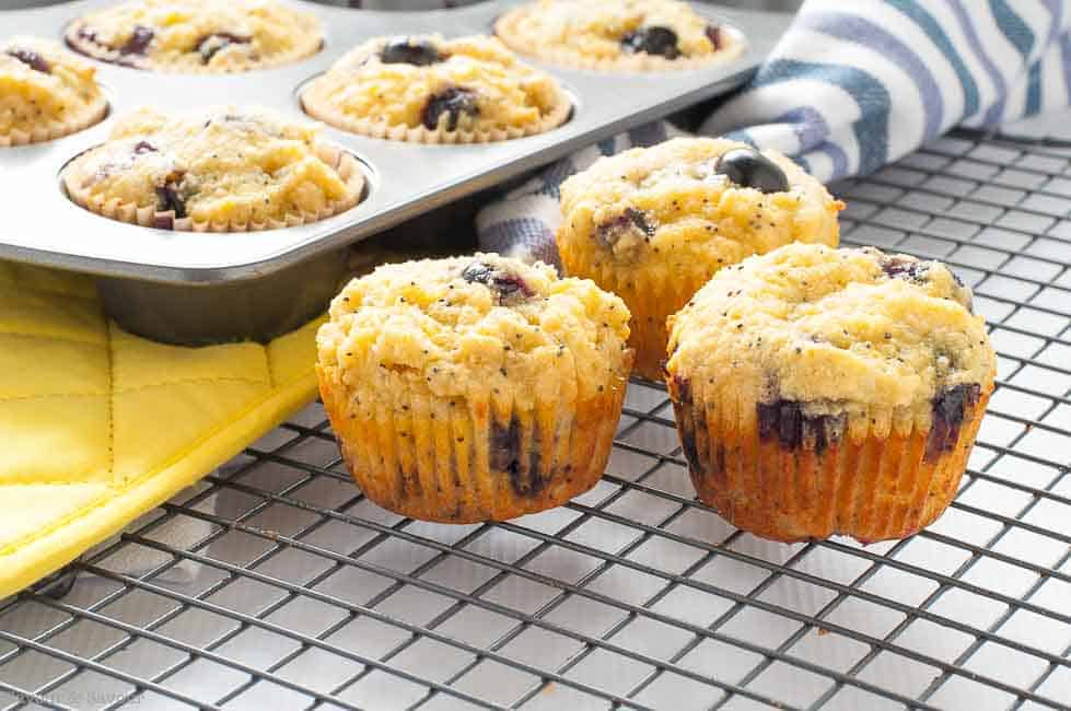 Paleo Blueberry Lemon Poppyseed Muffins cooling on a rack.