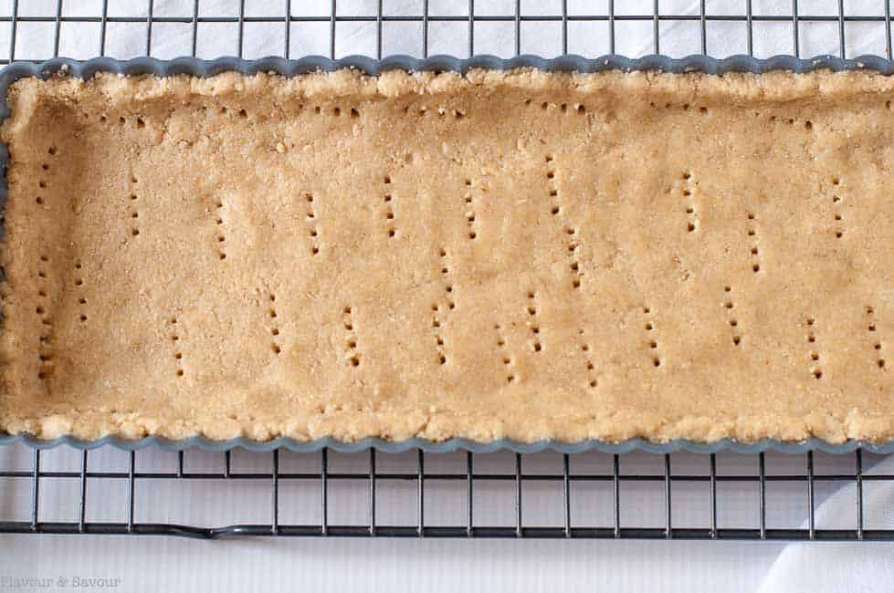 Gluten Free Sour Cherry Almond Tart crust "docked" by pricking holes with a fork. 