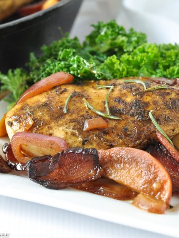 One pan spiced apple chicken with bacon with curly kale.