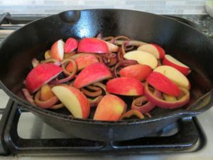 onions and apples browning for Spiced Chicken with Apples and Bacon