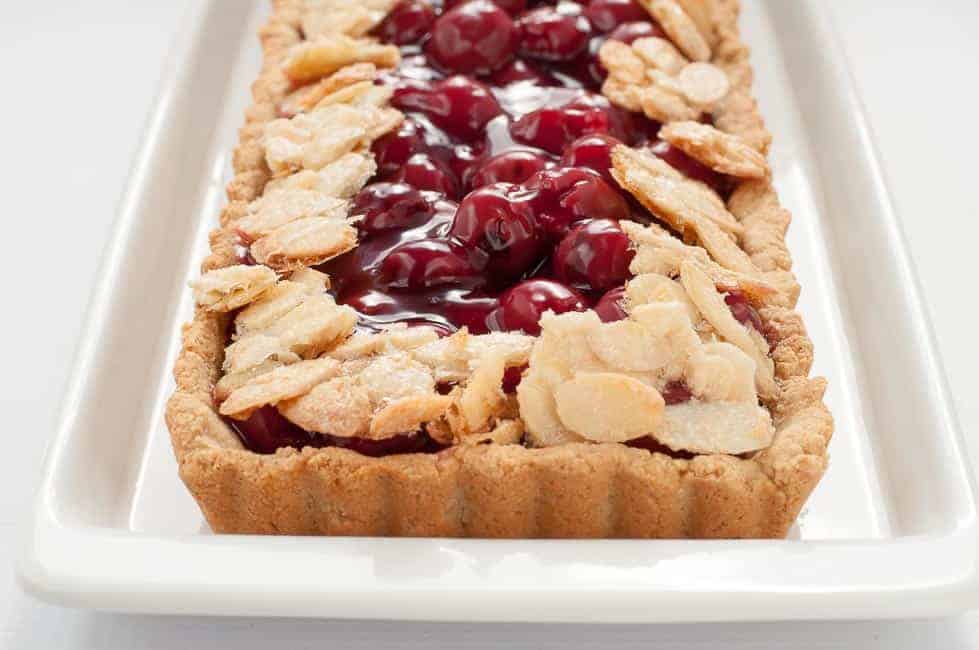 This Sour Cherry Almond Tart is gluten-free, it's just sweet enough, and it's an easy dessert to make for your next party!|www.flavourandsavour.com