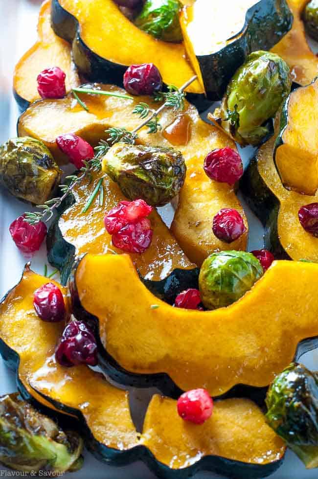 honey balsamic roasted acorn squash with Brussels Sprouts and cranberries