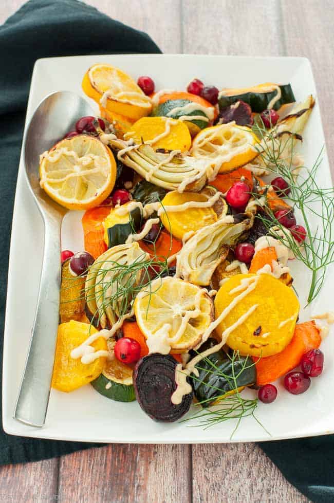 Lemon Tahini Roasted Vegetables. This one pan dish with a variety of oven roasted vegetables and lemon tahini dressing is a colourful, nutritious and flavourful side dish. Quick and easy. #Paleo and #vegan #tahini #roasted #harvest #vegetables 