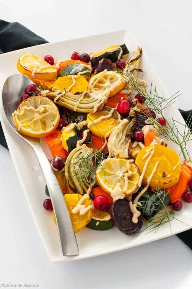 Lemon Tahini Roasted Vegetables. This one pan dish with a variety of oven roasted vegetables and lemon tahini dressing is a colourful, nutritious and flavourful side dish. Quick and easy. #Paleo and #vegan #tahini #roasted #harvest #vegetables 