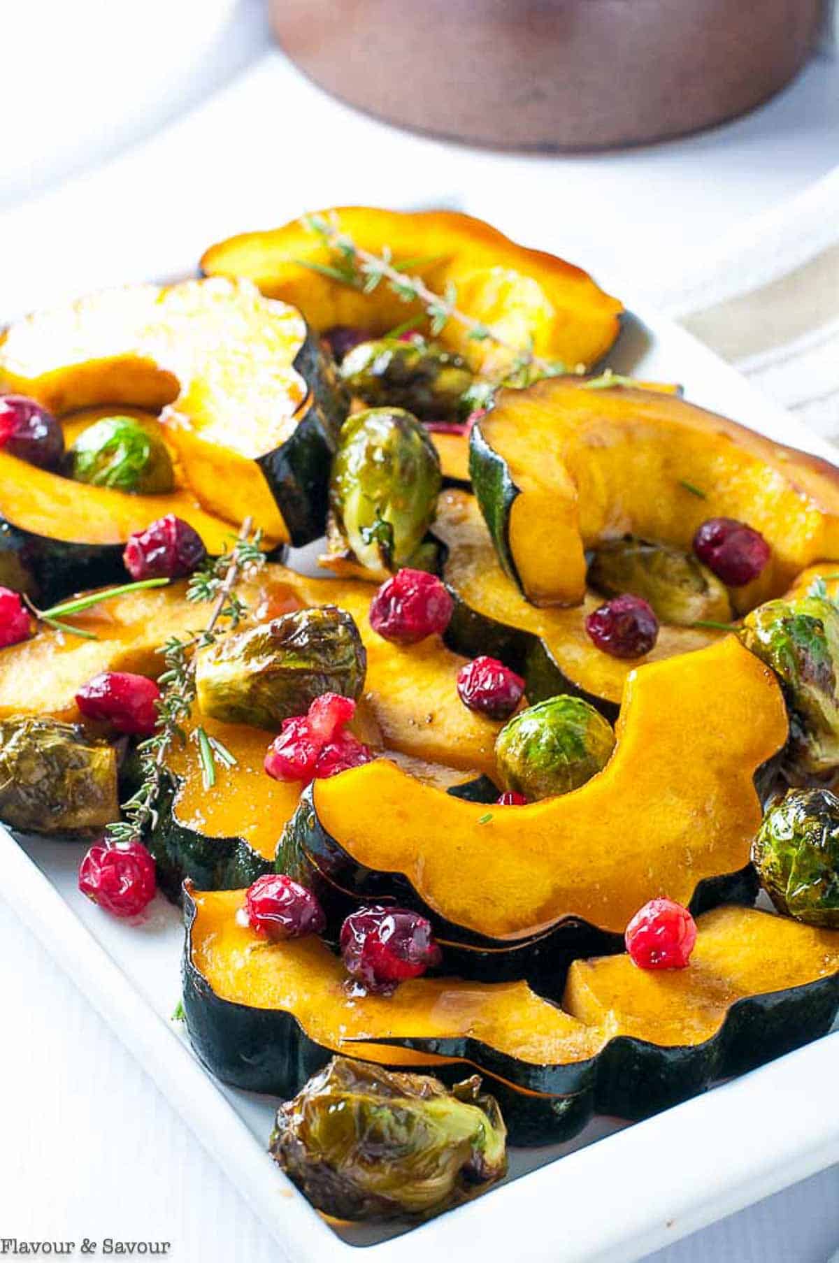 Honey balsamic roasted acorn squash with Brussels sprouts and cranberries.