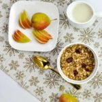 A bowl of Gingerbread Spiced Granola with Forelle pears