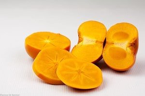 Persimmons cut to reveal inside