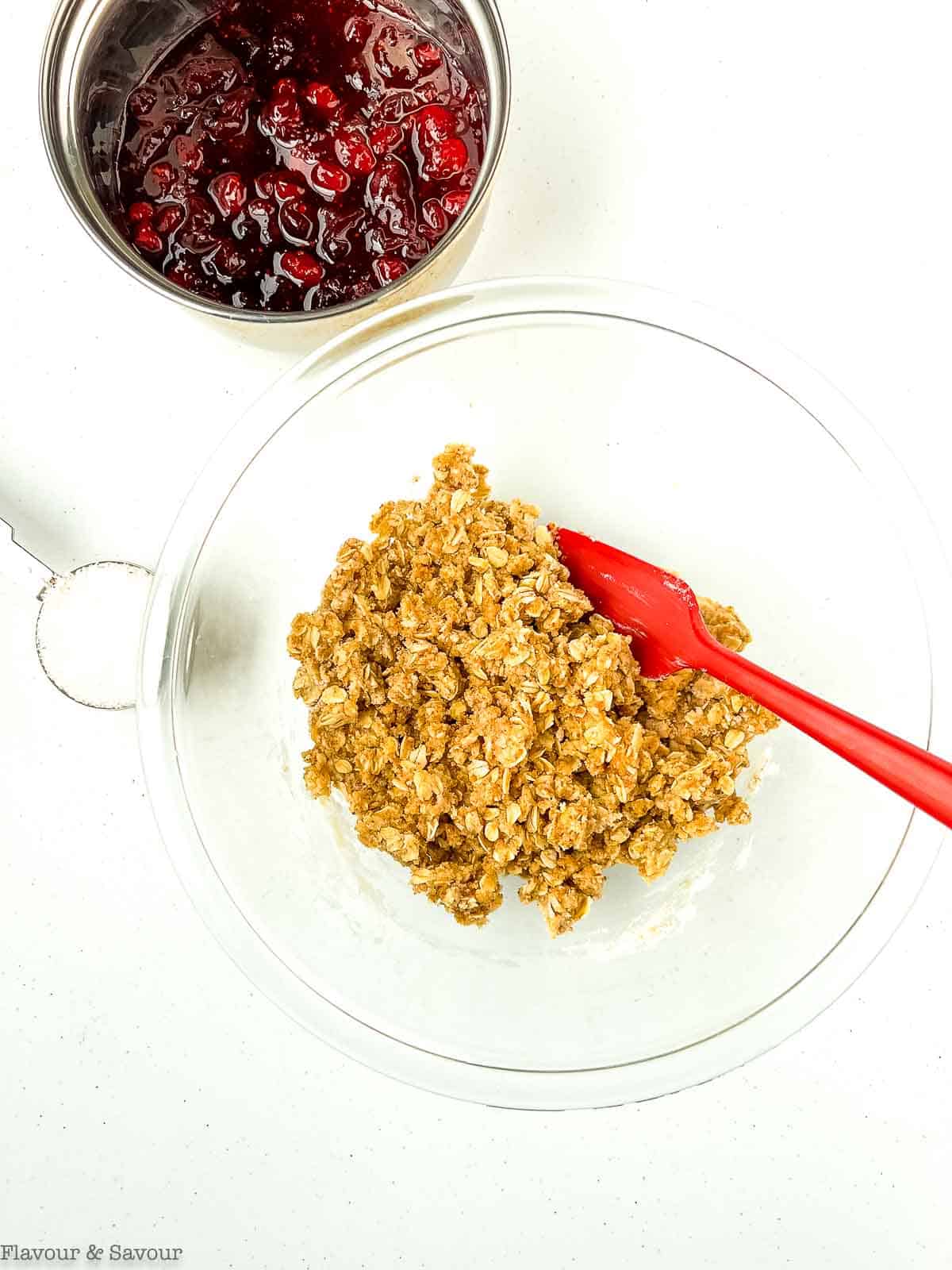 Combining ingredients for the crumble topping for cranberry lemon oatmeal bars.