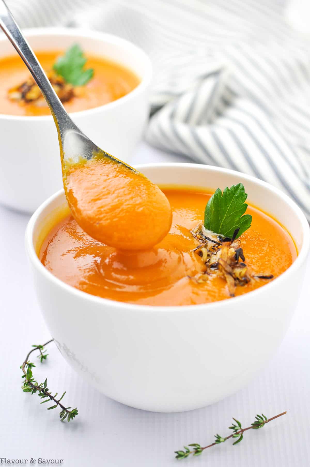 Dipping a spoon into Carrot Ginger Soup