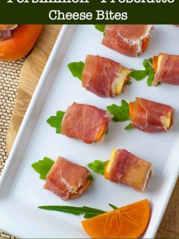 Persimmon Prosciutto Cheese Bites on a white serving tray