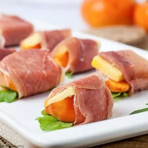 Close up view of Persimmon Prosciutto Cheese Bites