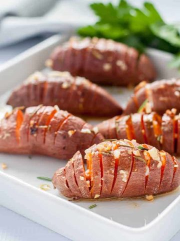 Baby Hasselback Sweet Potatoes with Garlic Herb Butter