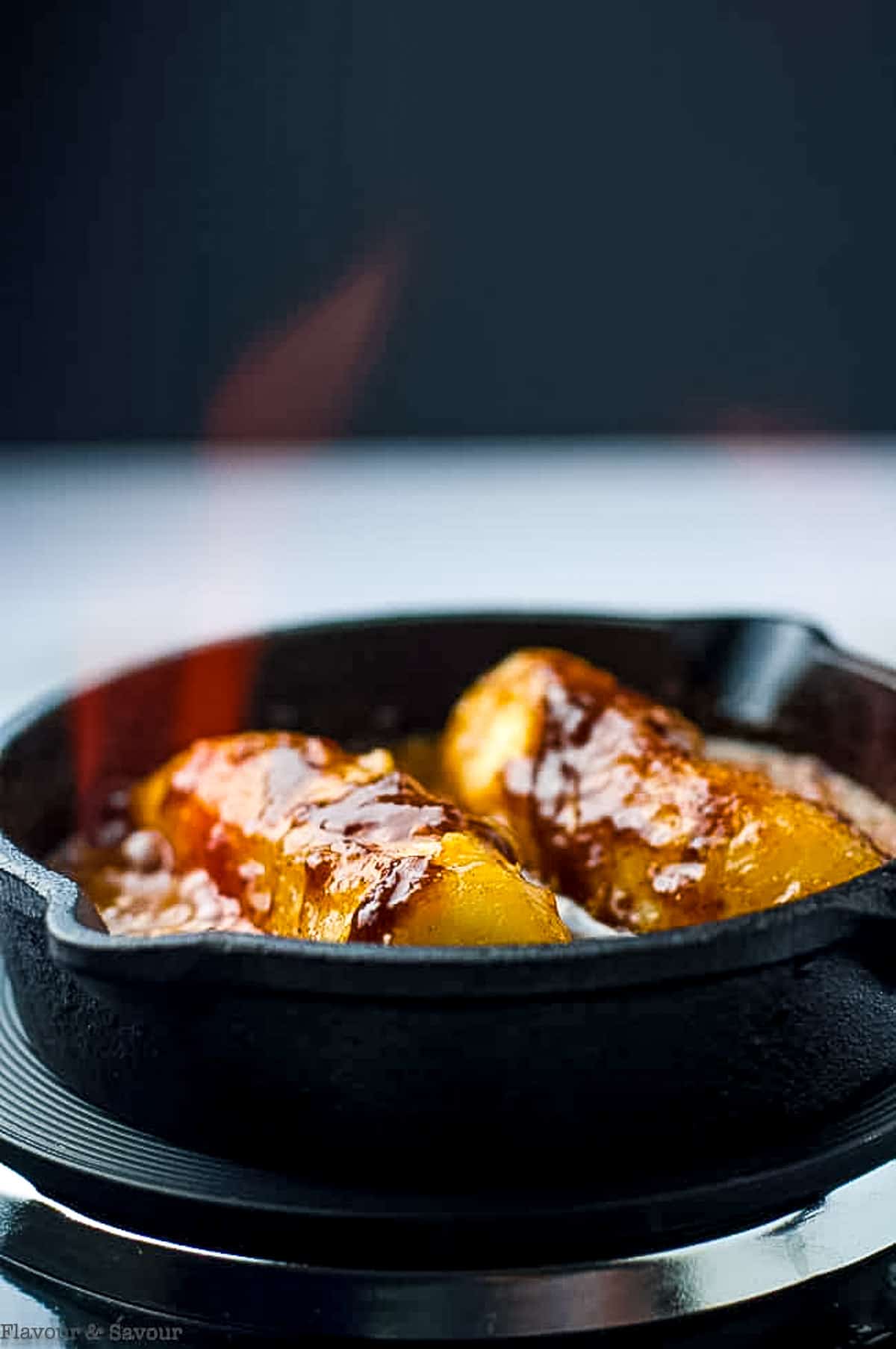 flaming caribbean rum bananas flambé in a skillet