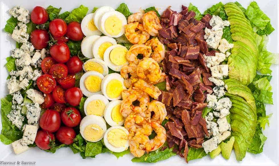 Lemon Garlic Shrimp Cobb Salad on platter. Overhead view.