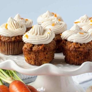 Mini Gluten-Free Carrot Cake Cupcakes with cream cheese frosting with fresh carrots