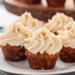 Mini Gluten-Free Carrot Cake Cupcakes with Cream Cheese Frosting on a plate.