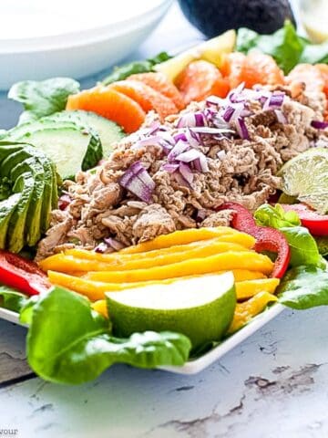 Caribbean Shredded Jerk Chicken Salad with mango, oranges, and avocado.