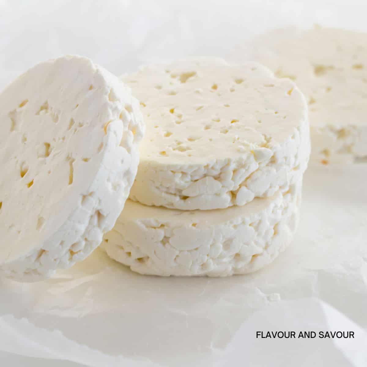 Rounds of feta cheese.