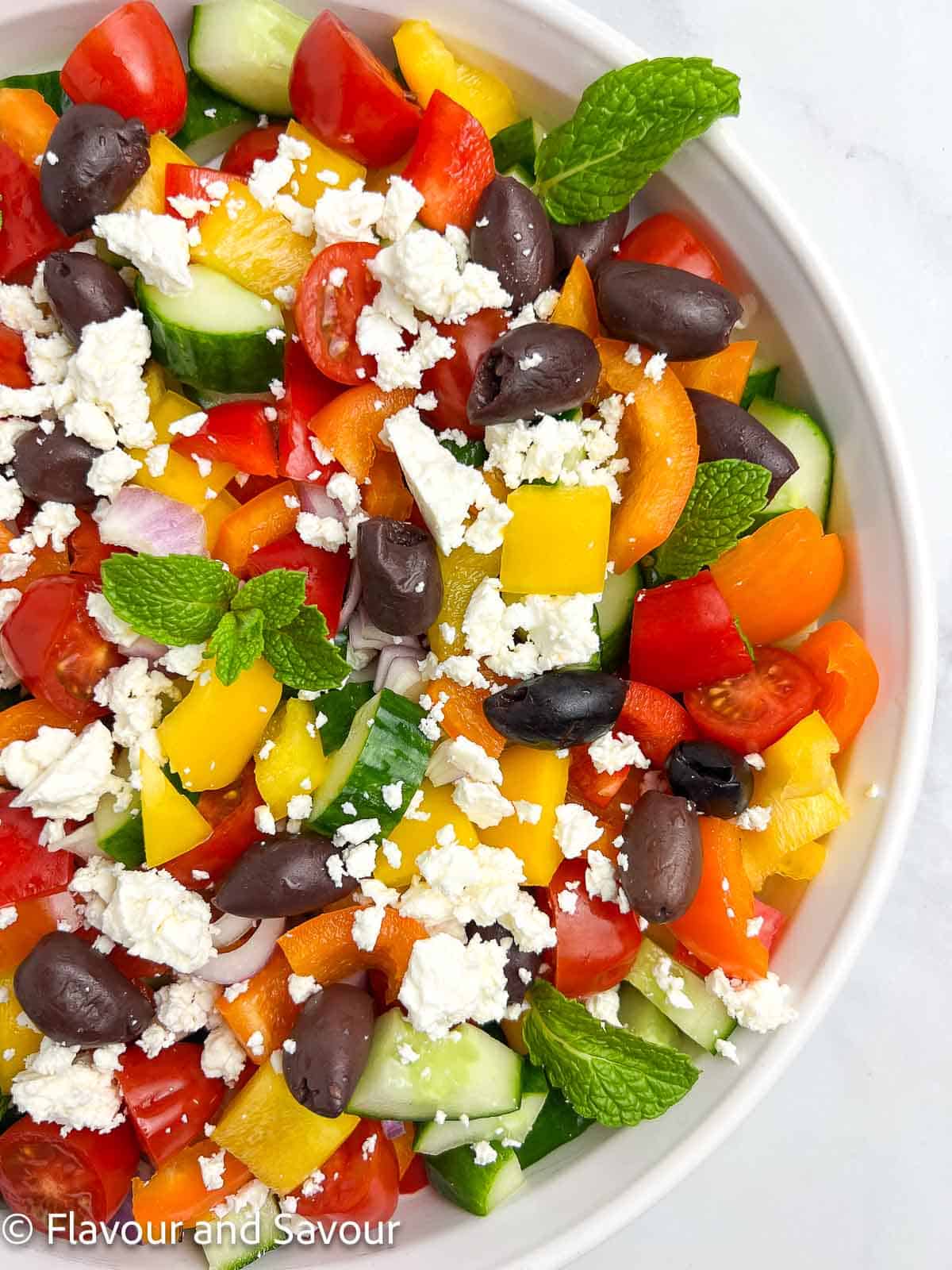 Greek salad with fresh mint leaves.