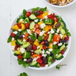 overhead view of Marinated Lemon Chicken Greek Salad with Mint and fresh herbs