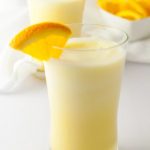 Orange Collage Creamsicle Shake with orange wedge garnish
