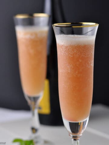 two flutes of rhubarb prosecco cocktail