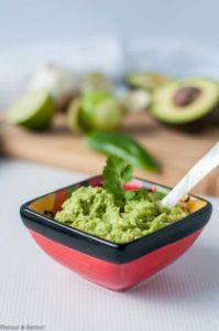 a small dish of Tomatillo Guacamole for Chicken Fajita Burgers