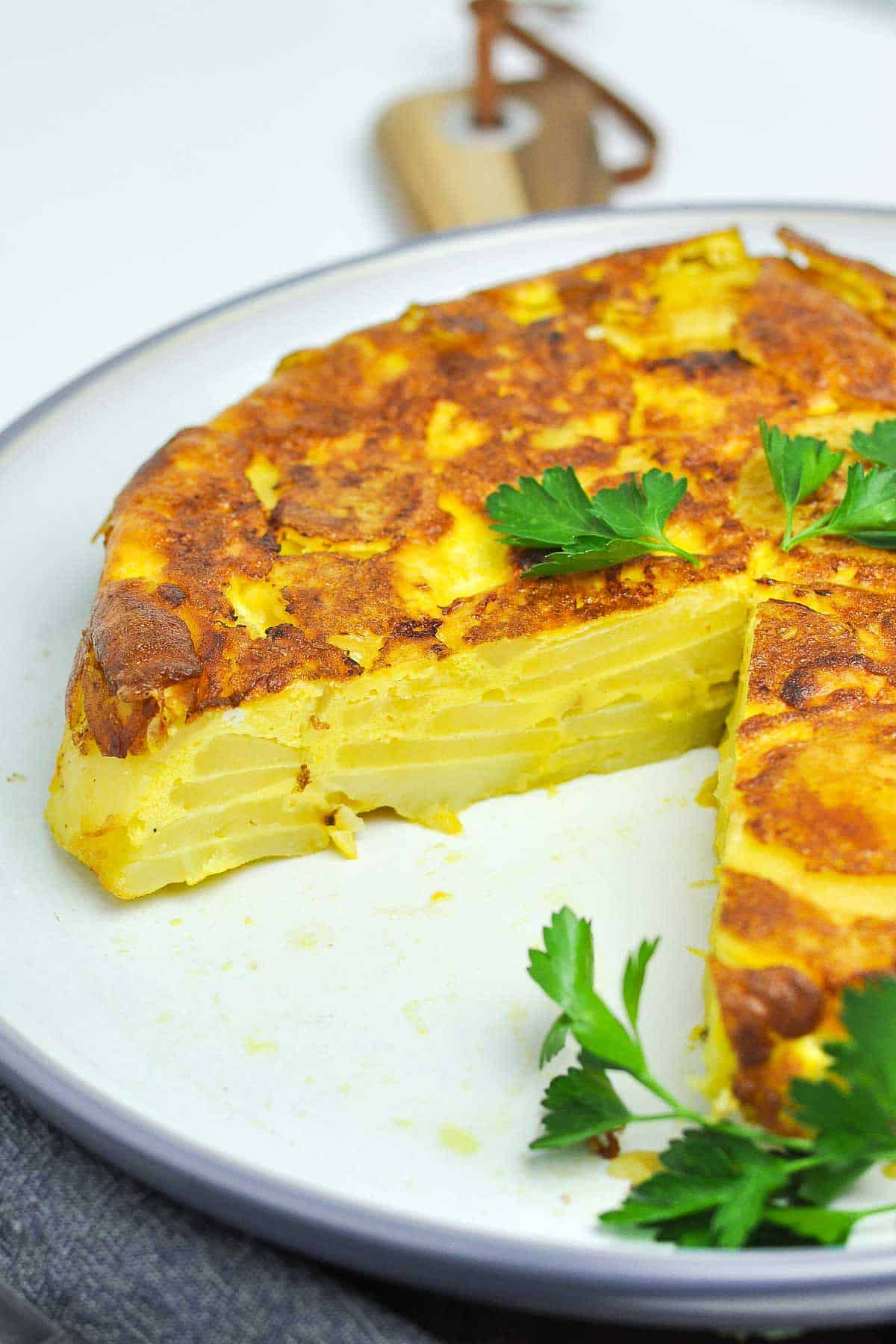 Close up view of the inside of a Spanish tortilla showing the layered potatoes.