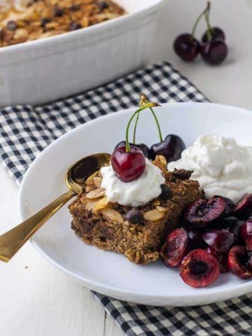 Chocolate Espresso Baked Oatmeal with yogurt and cherries in a bowl