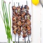 Chicken Yakitori Skewers with chives.