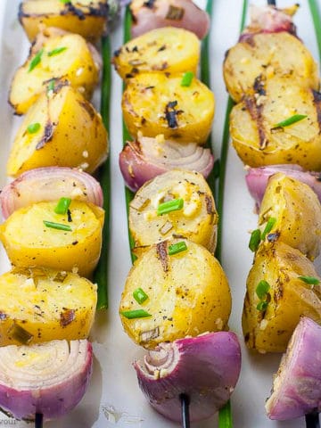 Grilled skewered lemon garlic potato kabobs.