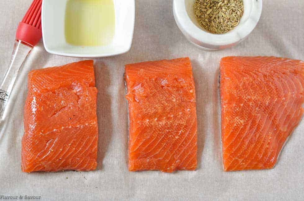 Salmon fillets brushed with olive oil.