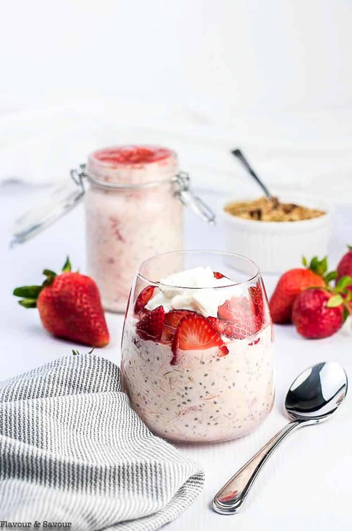 Glasses filled with strawberry rhubarb chia overnight oats.