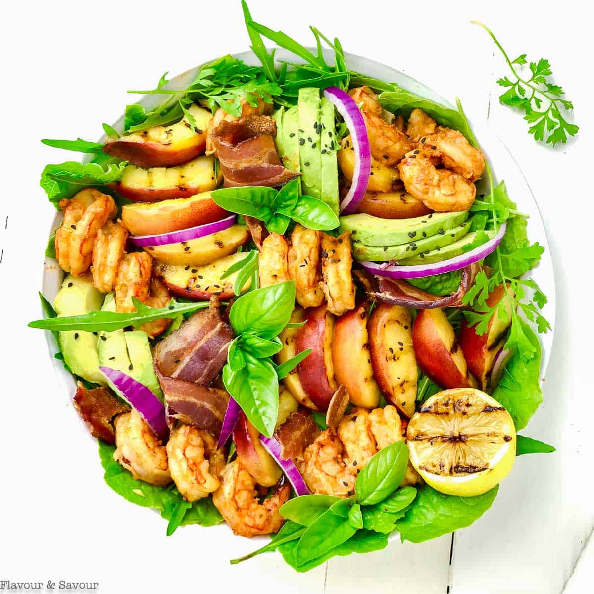 avocado grilled peach and chipotle shrimp salad overhead view
