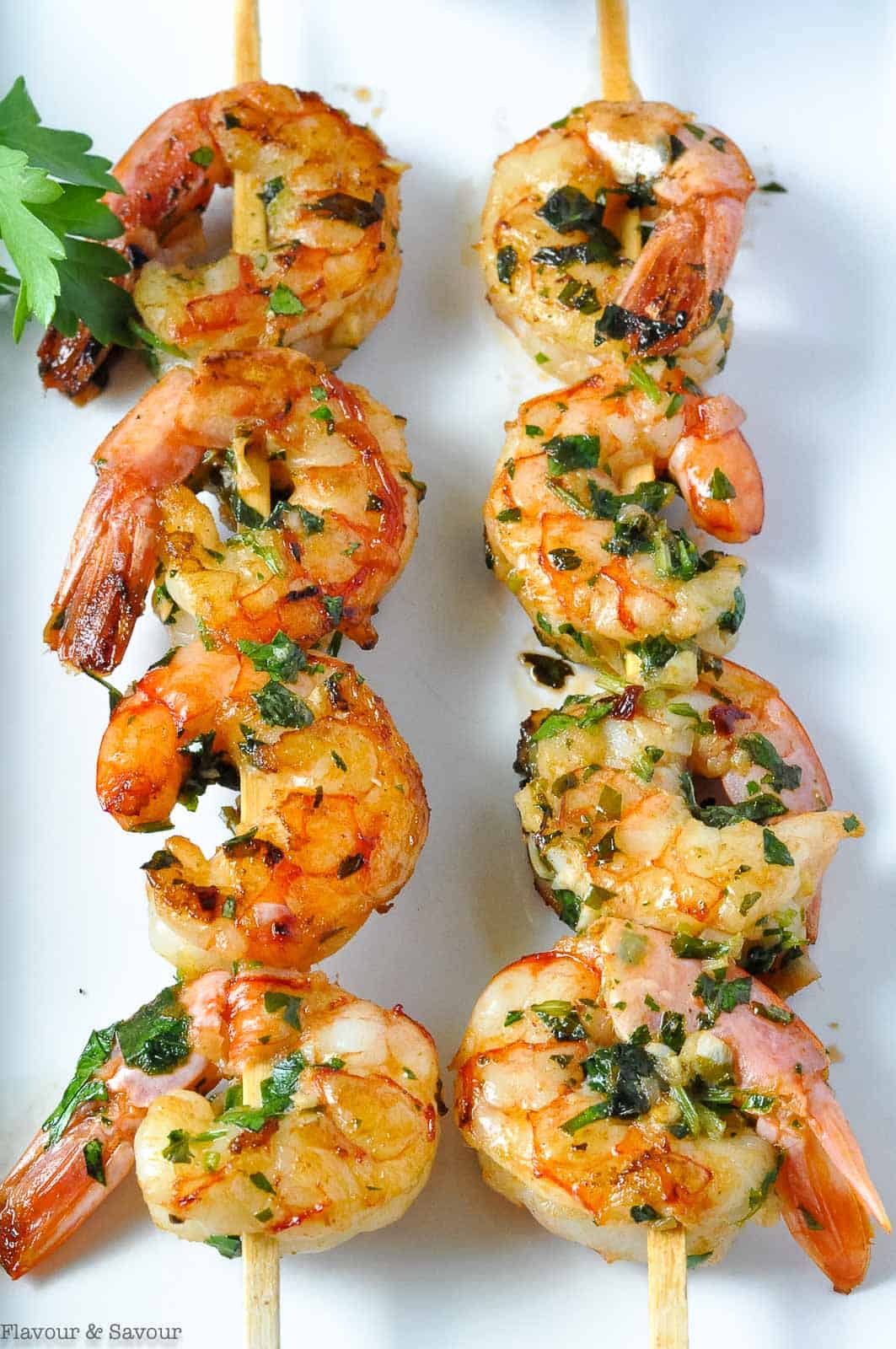 Two skewers with Chimichurri shrimp.