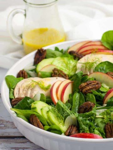 Fennel Apple Chicken Salad with a a jug of dressing
